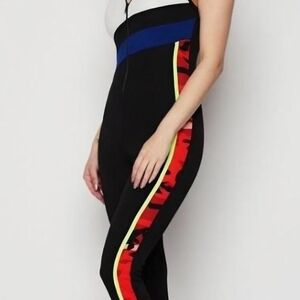 Stylish Black Zipper Front Jumpsuit with Red and Blue Accents